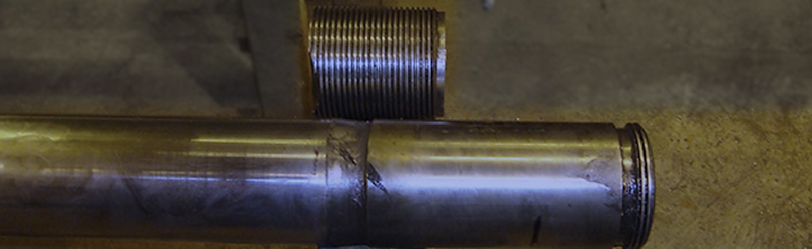 Repaired tie bar showing the weld joint and new threaded end
