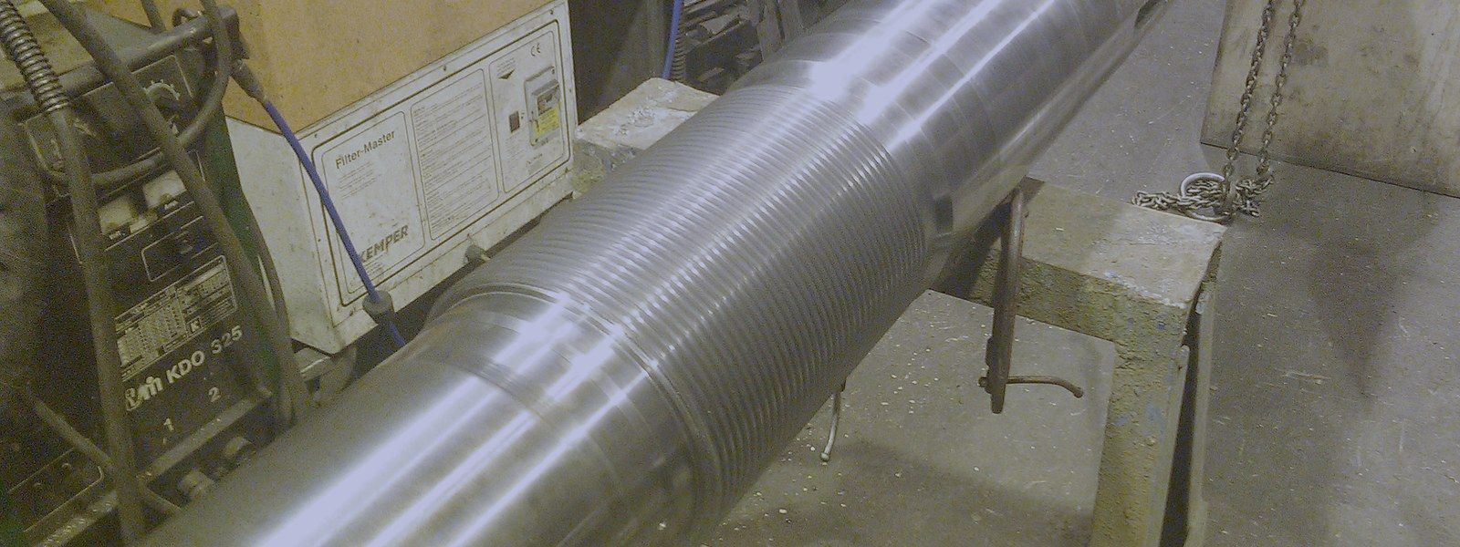 Large tie bar with a machined thread, on a trestle in the TWS workshop